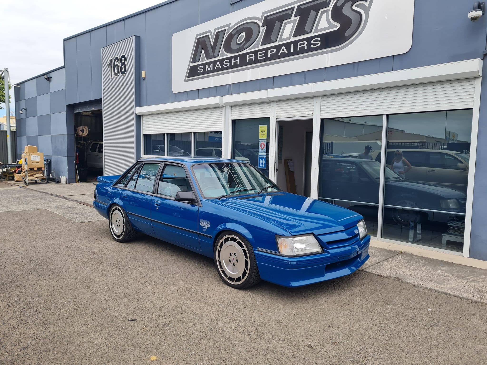 Blue Commodore after accident repair
